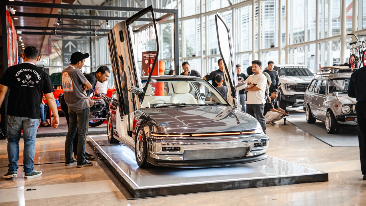 Modified Honda Civic Super Nouva with chrome bodywork and retro Japanese hatchback styling displayed at IMX 2026.